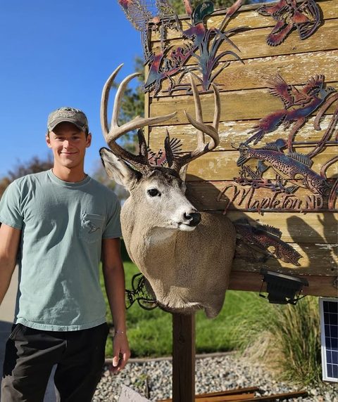 Customer with their finished mount from Jason's Taxidermy