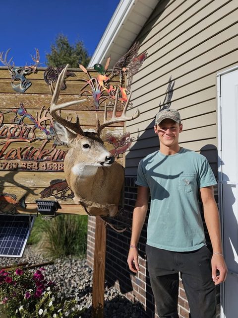 Customer with their finished mount from Jason's Taxidermy