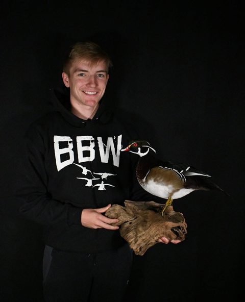 Customer with their finished mount from Jason's Taxidermy