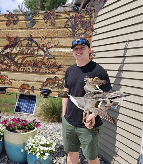 Customer with their finished mount from Jason's Taxidermy
