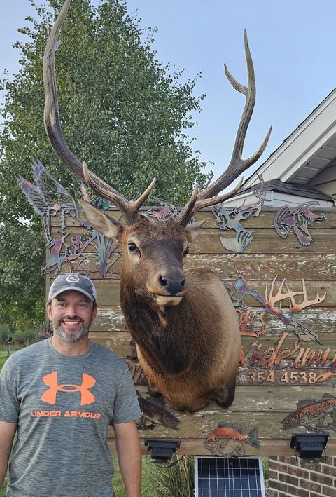 Customer with their finished mount from Jason's Taxidermy
