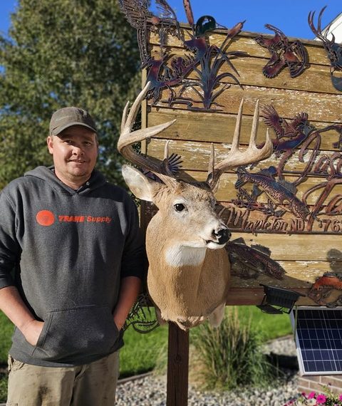 Customer with their finished mount from Jason's Taxidermy