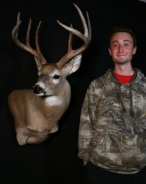 Customer with their finished mount from Jason's Taxidermy