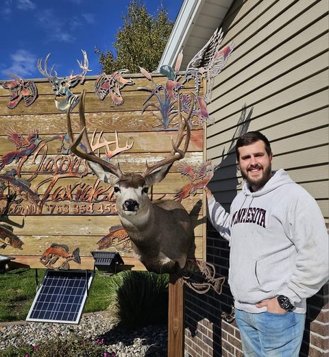 Customer with their finished mount from Jason's Taxidermy