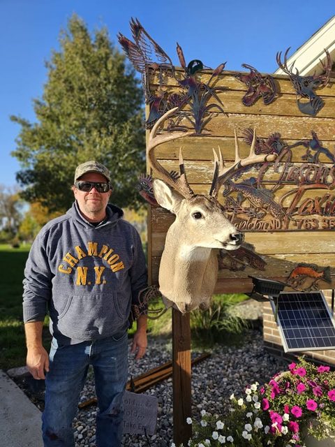 Customer with their finished mount from Jason's Taxidermy