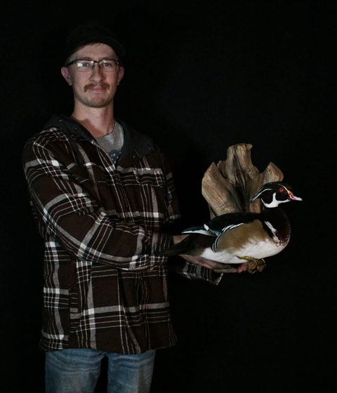 Customer with their finished mount from Jason's Taxidermy