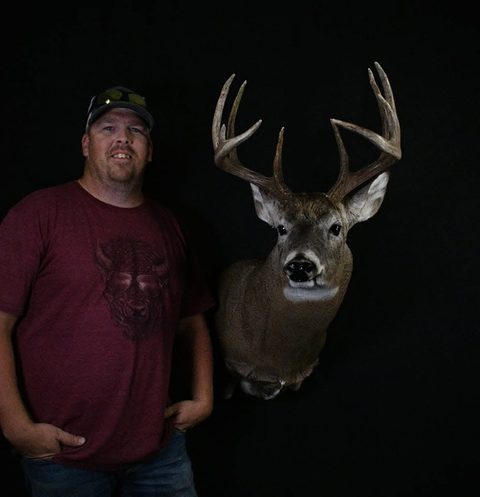 Customer with their finished mount from Jason's Taxidermy