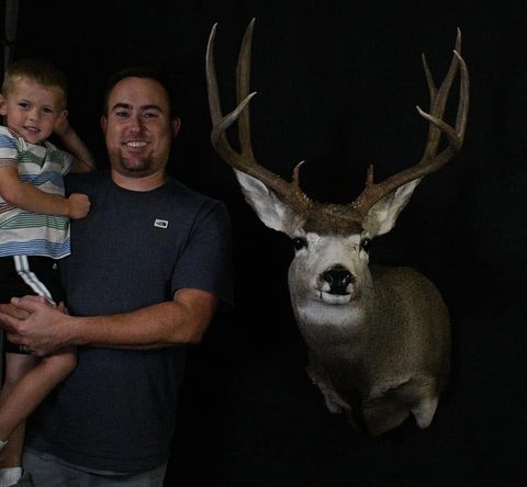 Customer with their finished mount from Jason's Taxidermy