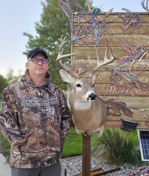 Customer with their finished mount from Jason's Taxidermy