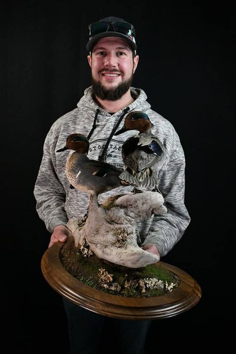 Customer with their finished mount from Jason's Taxidermy