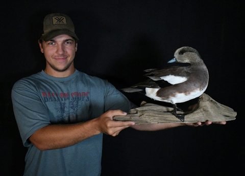 Customer with their finished mount from Jason's Taxidermy
