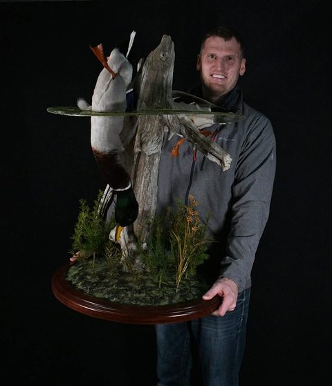 Customer with their finished mount from Jason's Taxidermy