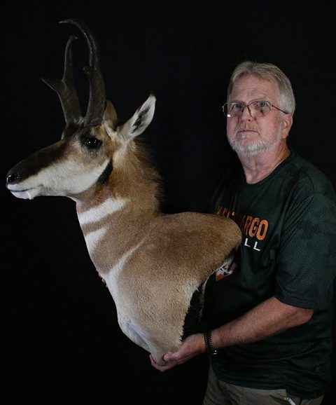 Customer with their finished mount from Jason's Taxidermy