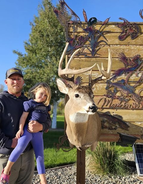 Customer with their finished mount from Jason's Taxidermy
