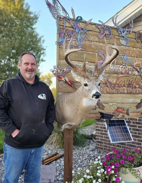 Customer with their finished mount from Jason's Taxidermy