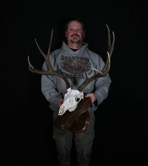Customer with their finished mount from Jason's Taxidermy