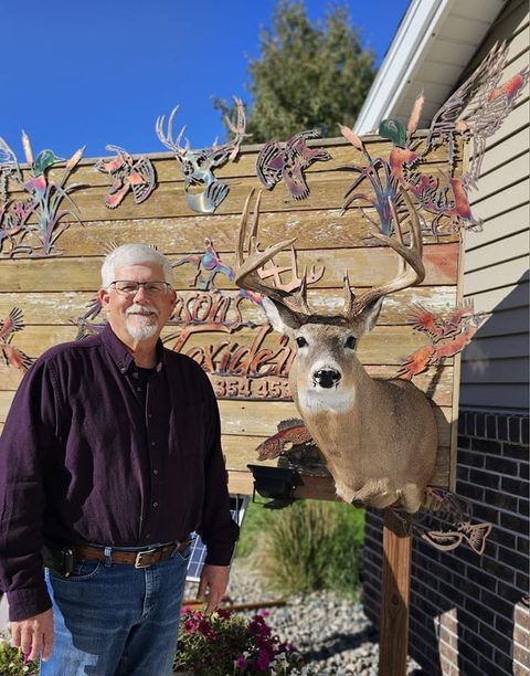 Customer with their finished mount from Jason's Taxidermy