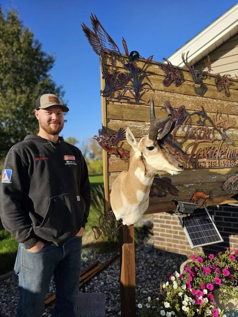 Customer with their finished mount from Jason's Taxidermy