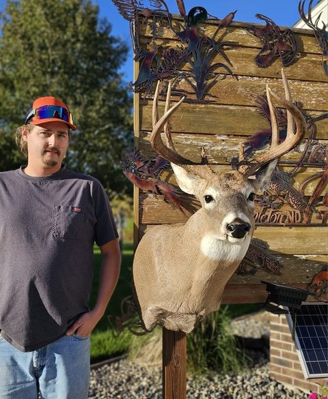 Customer with their finished mount from Jason's Taxidermy
