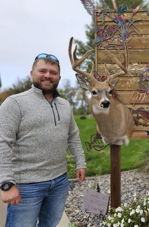 Customer with their finished mount from Jason's Taxidermy