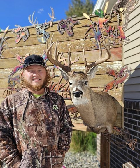 Customer with their finished mount from Jason's Taxidermy