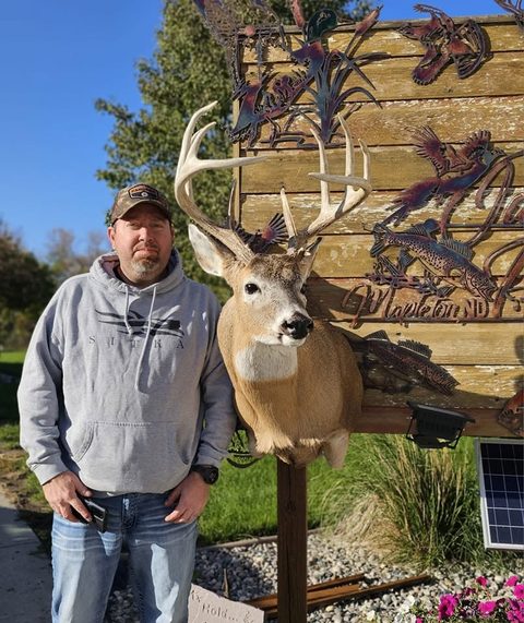 Customer with their finished mount from Jason's Taxidermy