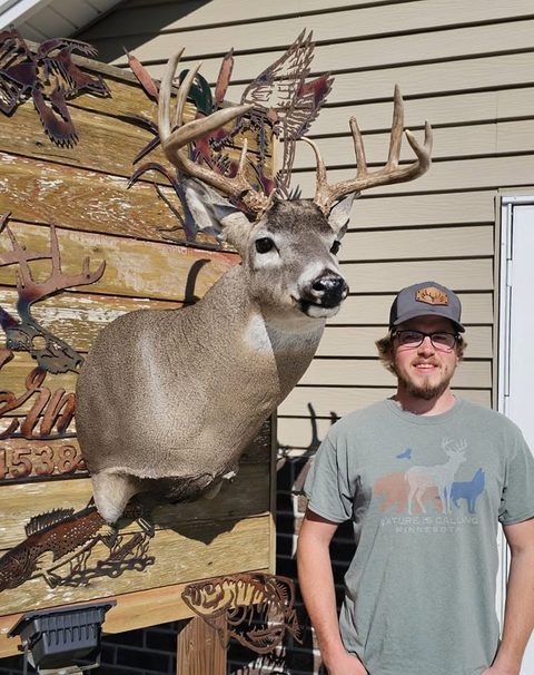 Customer with their finished mount from Jason's Taxidermy