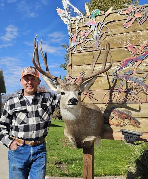 Customer with their finished mount from Jason's Taxidermy